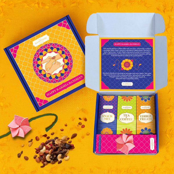 Colorful gift box with tea and snacks on a yellow background . Premium rakhi gift box for bhaiya , bhabhi and sister